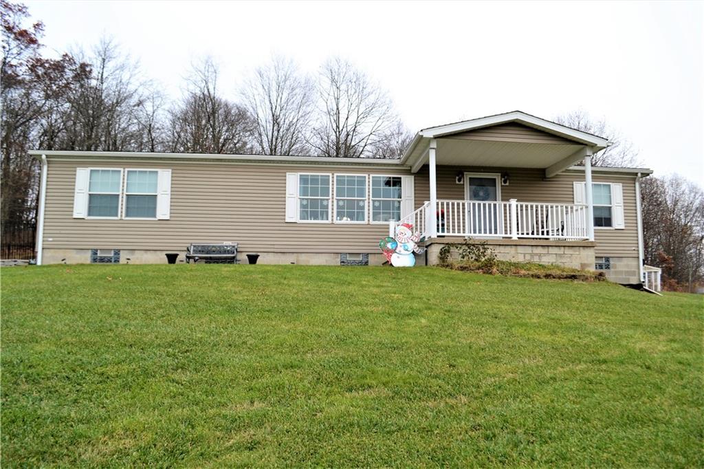 222 Toy Road Kittanning, PA 16201 - Photo 23 of 25 a front view of house with yard and green space