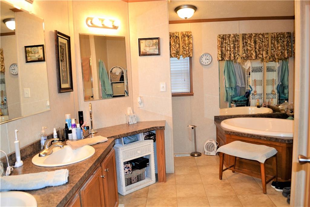 222 Toy Road Kittanning, PA 16201 - Photo 10 of 25 a bathroom with a sink and a mirror