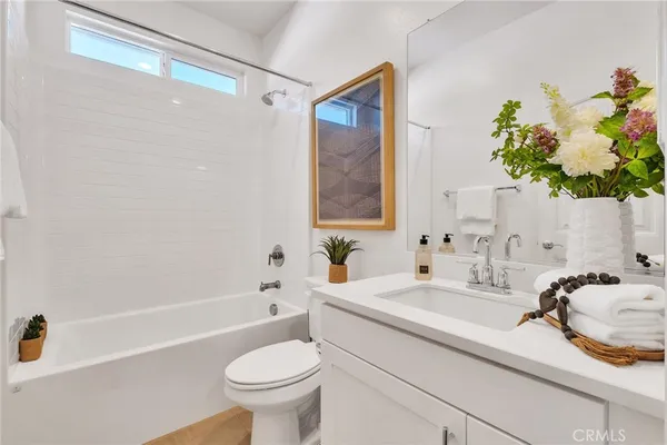 a bathroom with a sink a toilet and a bathtub