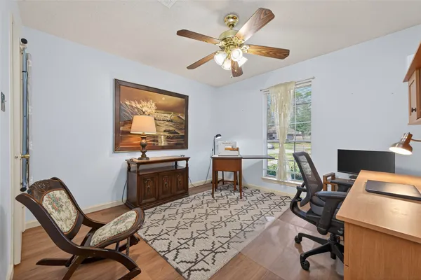 a workspace with wooden floor and a workspace