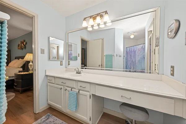 a spacious bathroom with a sink double vanity and a mirror