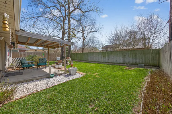 a view of a backyard with a patio