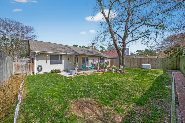 a front view of house with yard patio and green space