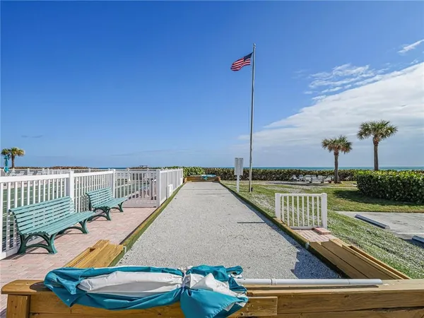 a view of a balcony with ocean view