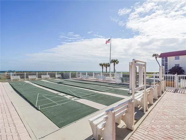 a view of swimming pool with outdoor seating