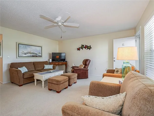 a bedroom with furniture and a flat screen tv