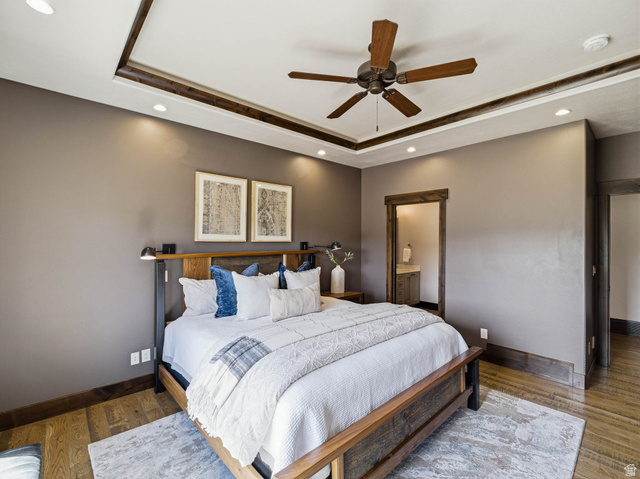 402 Shadow Hill Road Wanship, UT 84017 - Photo 24 of 90 Bedroom featuring recessed lighting, wood finished floors, a raised ceiling, ceiling fan, and connected bathroom
