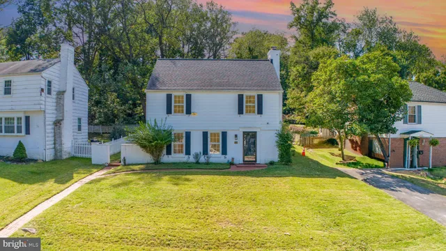 a view of a house with swimming pool and porch