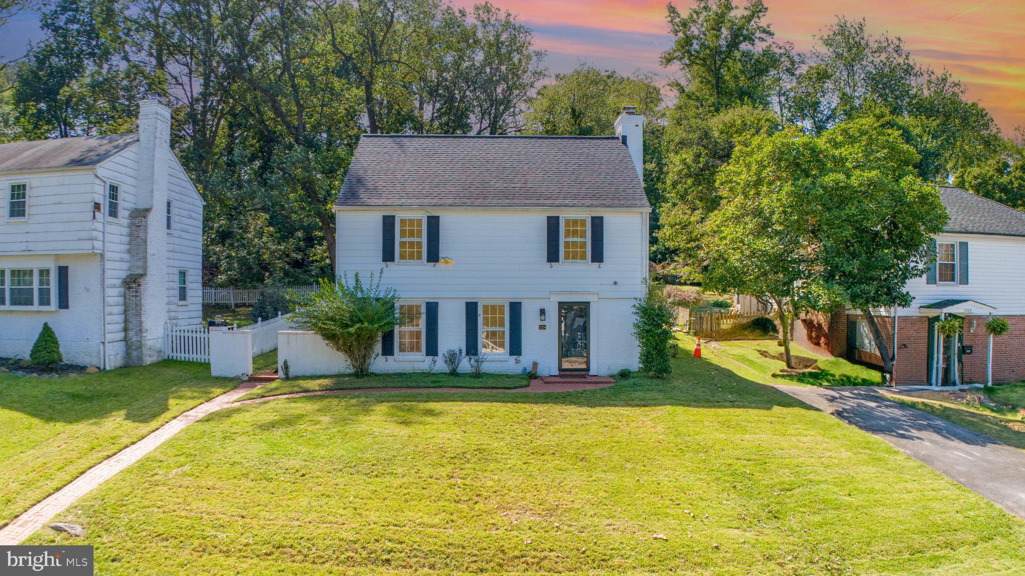 a view of a house with swimming pool and porch