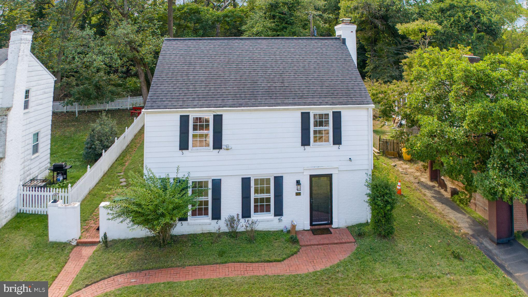 2304 Pickwick Road Baltimore, MD 21207 - Photo 2 of 37 front view of a house with a yard