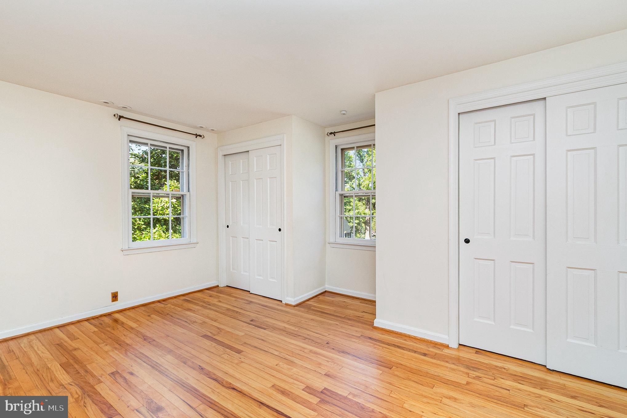 2304 Pickwick Road Baltimore, MD 21207 - Photo 21 of 37 a view of empty room with wooden floor and fan