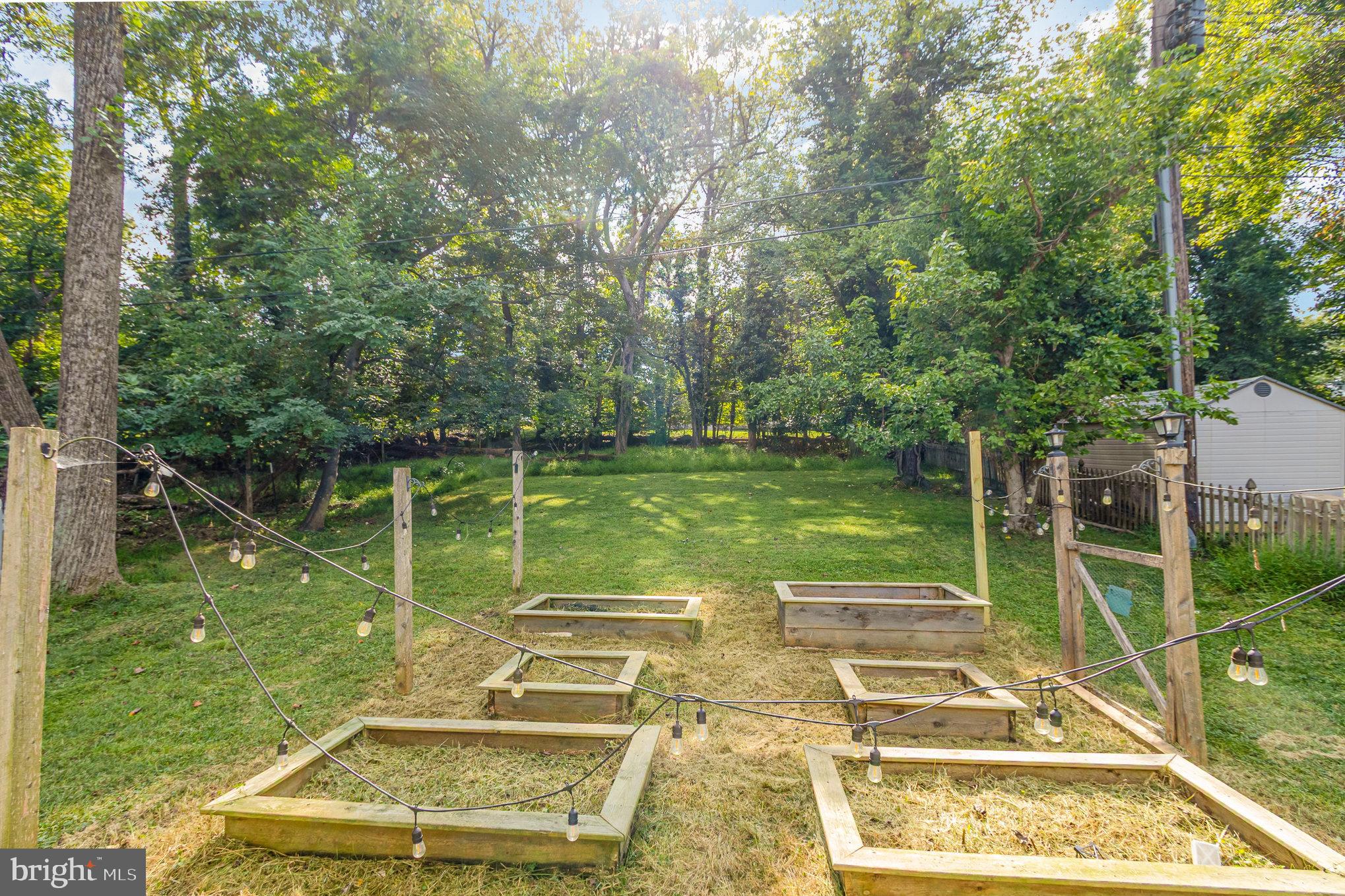 2304 Pickwick Road Baltimore, MD 21207 - Photo 31 of 37 a view of a wooden deck with a yard