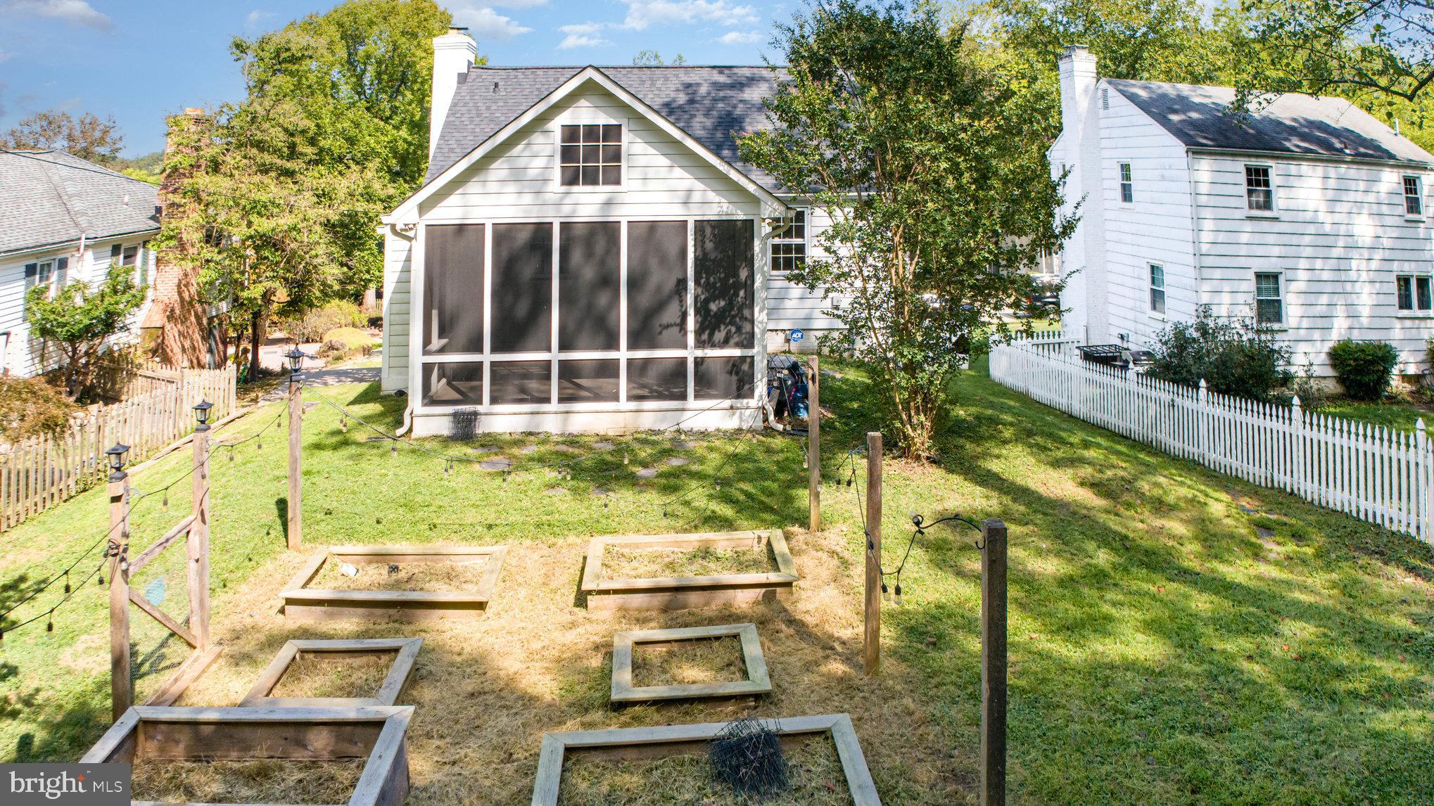 2304 Pickwick Road Baltimore, MD 21207 - Photo 33 of 37 a view of house with yard outdoor seating and covered with trees