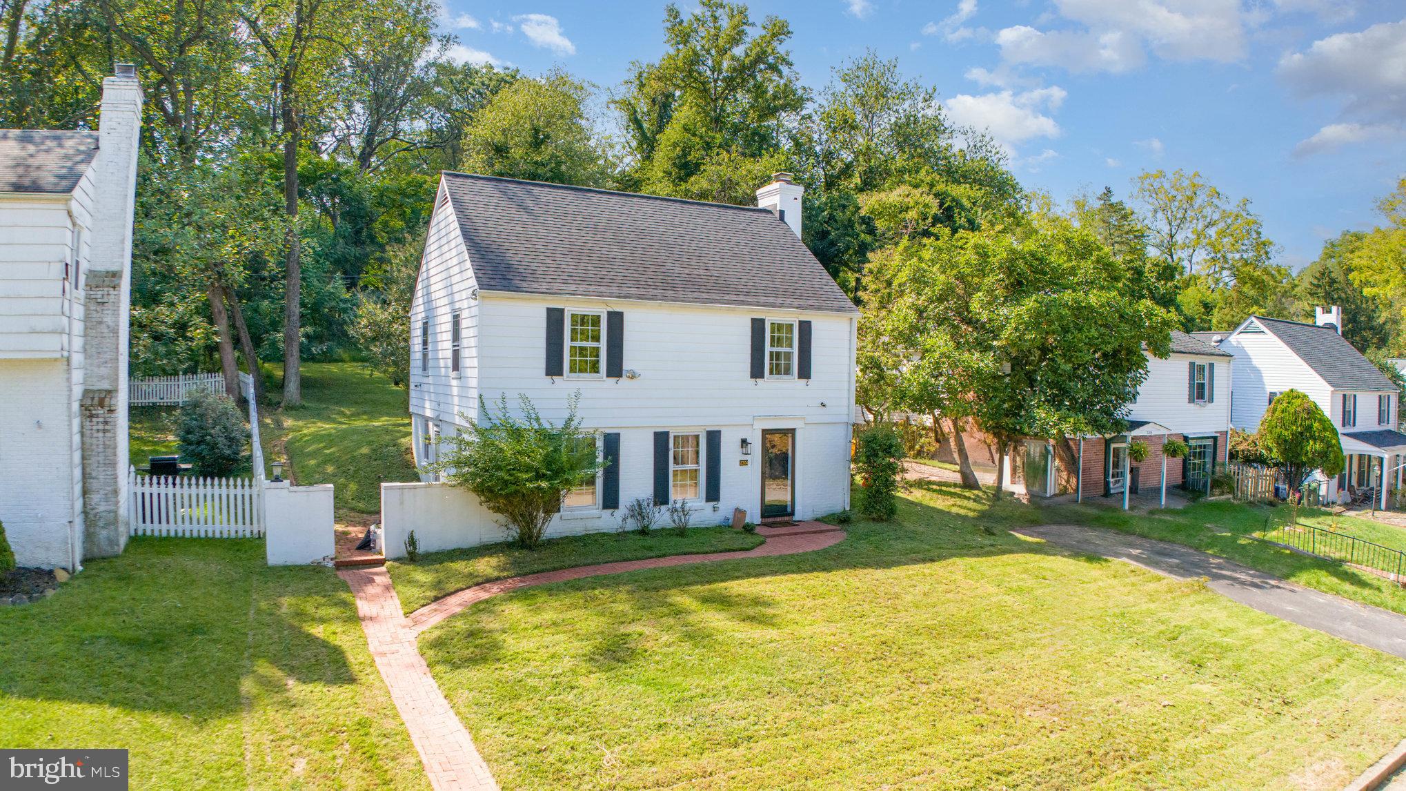 2304 Pickwick Road Baltimore, MD 21207 - Photo 4 of 37 a house view with swimming pool and garden