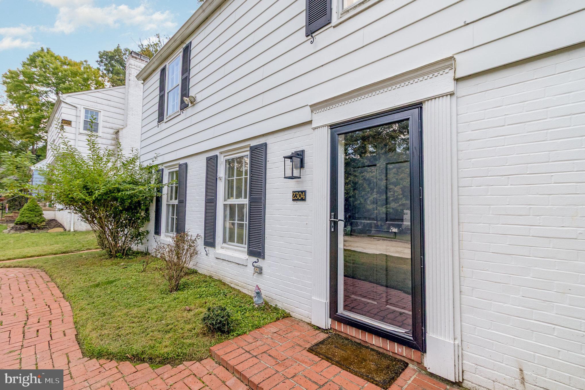 2304 Pickwick Road Baltimore, MD 21207 - Photo 5 of 37 a front view of a house with a yard
