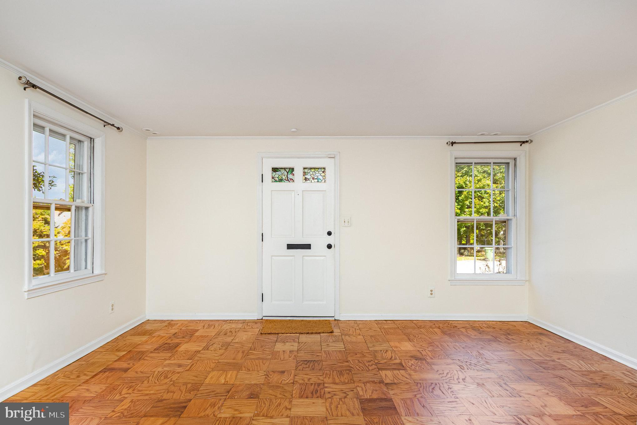 2304 Pickwick Road Baltimore, MD 21207 - Photo 7 of 37 a view of an empty room with window