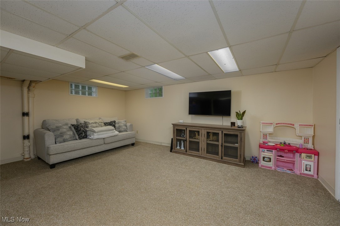 4946 Tioga Street Northwest Canton, OH 44708 - Photo 12 of 21 Finished lower level area with carpet floors