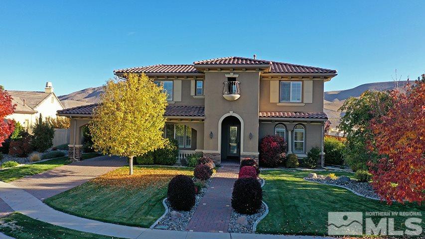 2655 Strathmore Court Reno, NV 89521 - Photo 1 of 38 a front view of house with yard and green space