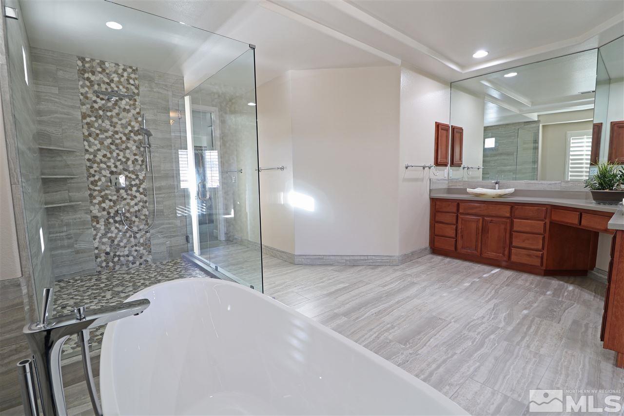 2655 Strathmore Court Reno, NV 89521 - Photo 11 of 38 a bathroom with double vanity and a shower