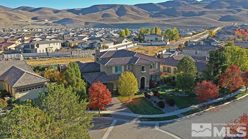 2655 Strathmore Court Reno, NV 89521 - Photo 25 of 38 an aerial view of a house with a garden and lake view