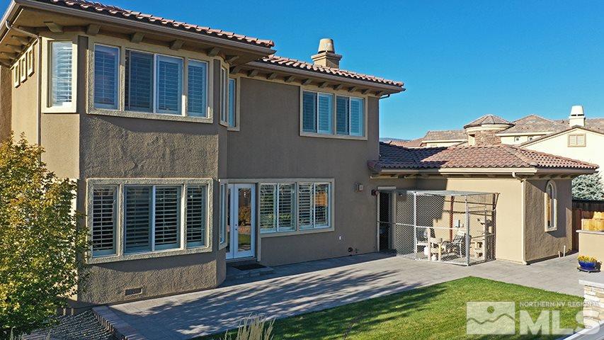 2655 Strathmore Court Reno, NV 89521 - Photo 32 of 38 a view of house with backyard porch and sitting area