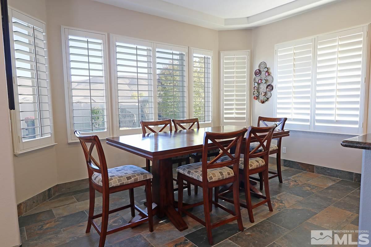 2655 Strathmore Court Reno, NV 89521 - Photo 9 of 38 a view of a dining room with furniture and windows