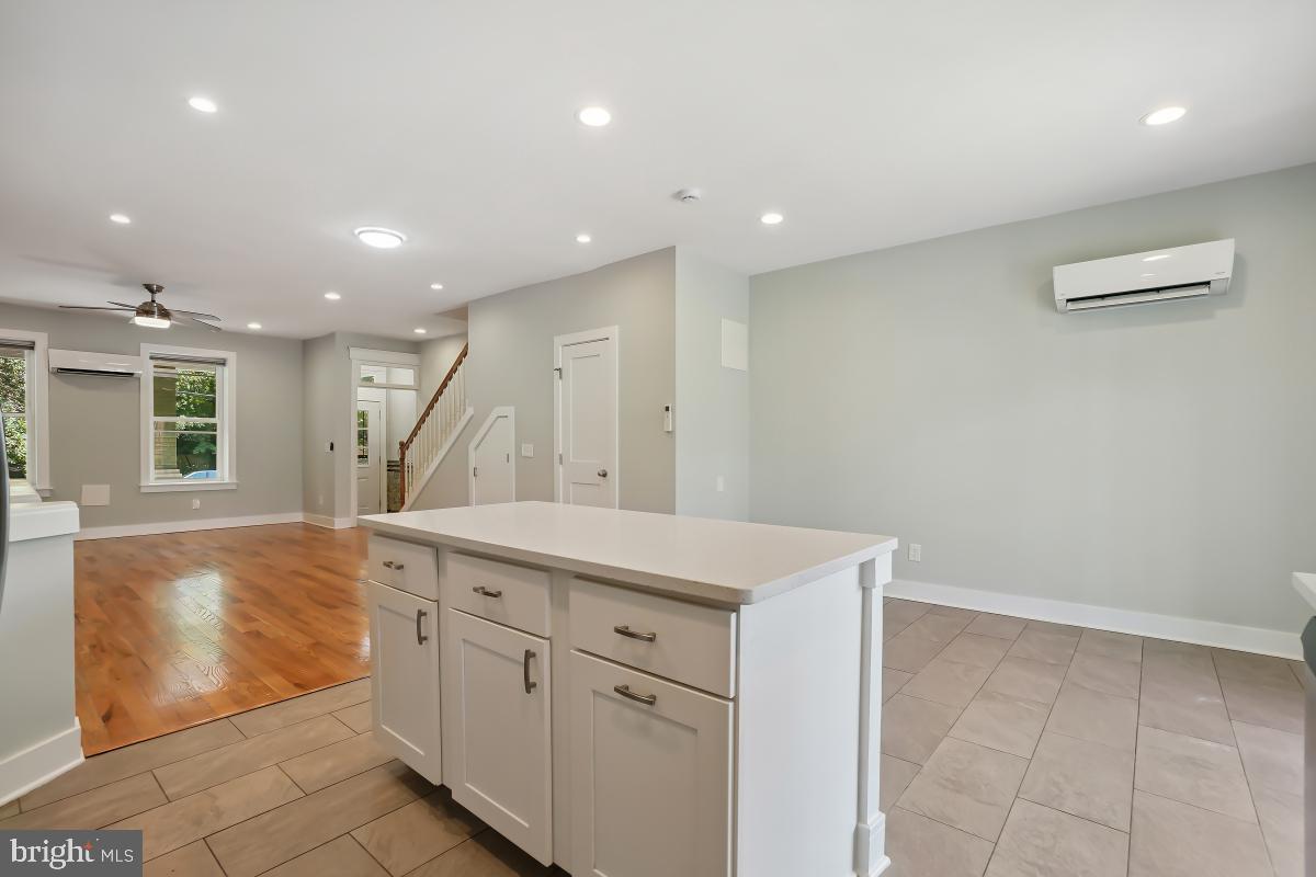 37 Michigan Avenue Northeast Washington, DC 20002 - Photo 14 of 31 a spacious bathroom with a granite countertop sink a mirror and a vanity