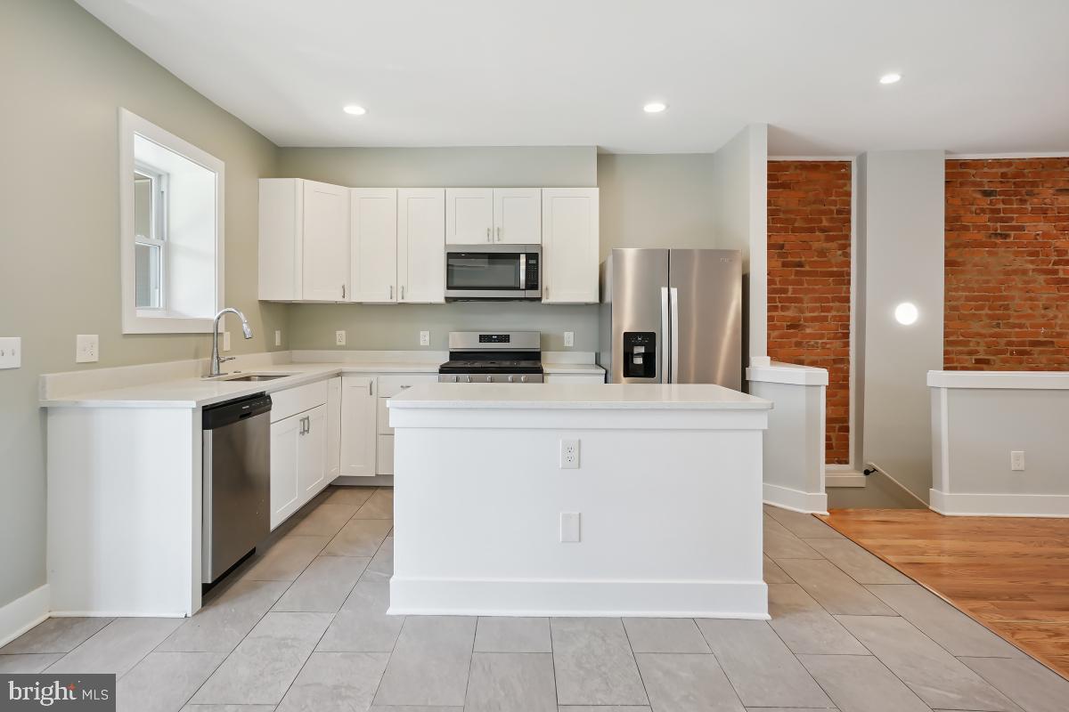 37 Michigan Avenue Northeast Washington, DC 20002 - Photo 15 of 31 a kitchen with stainless steel appliances a refrigerator sink and microwave