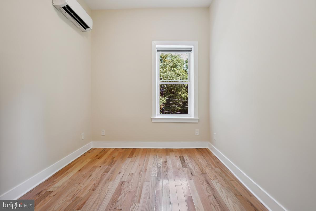 37 Michigan Avenue Northeast Washington, DC 20002 - Photo 17 of 31 a view of a room with wooden floor and window