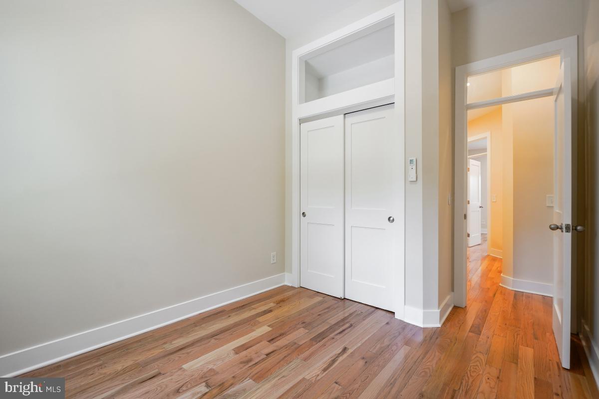 37 Michigan Avenue Northeast Washington, DC 20002 - Photo 19 of 31 a view of a room with wooden floor and a gate