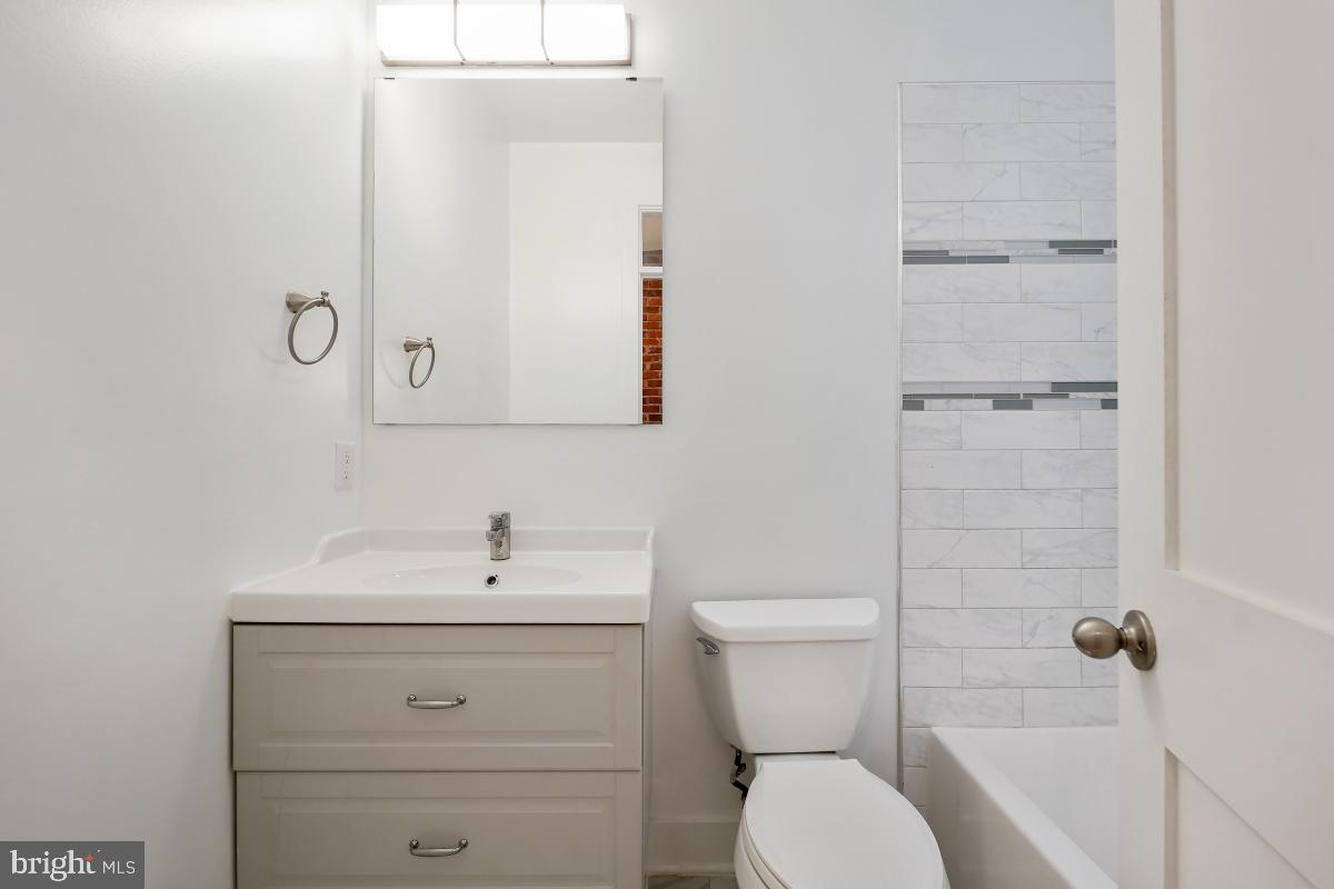 37 Michigan Avenue Northeast Washington, DC 20002 - Photo 21 of 31 a bathroom with a sink a toilet and shower