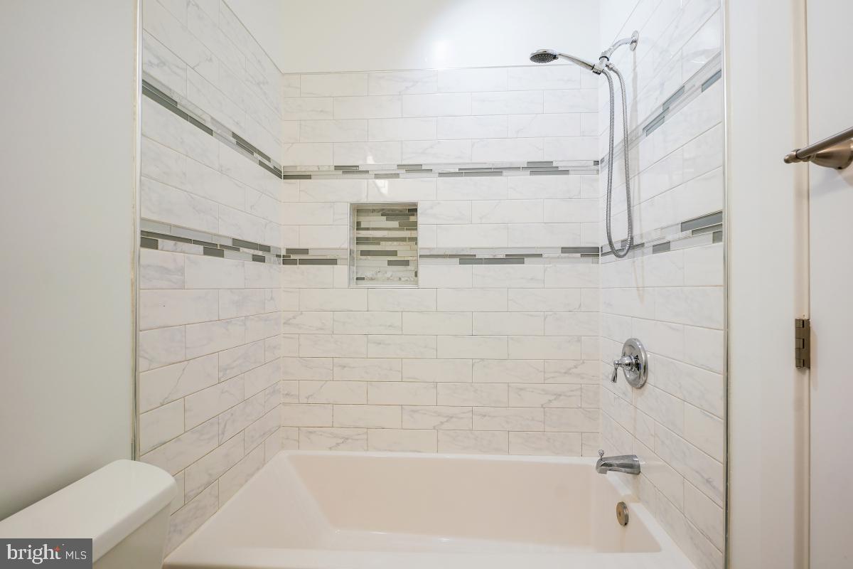 37 Michigan Avenue Northeast Washington, DC 20002 - Photo 22 of 31 a bathroom with a shower and a bathtub