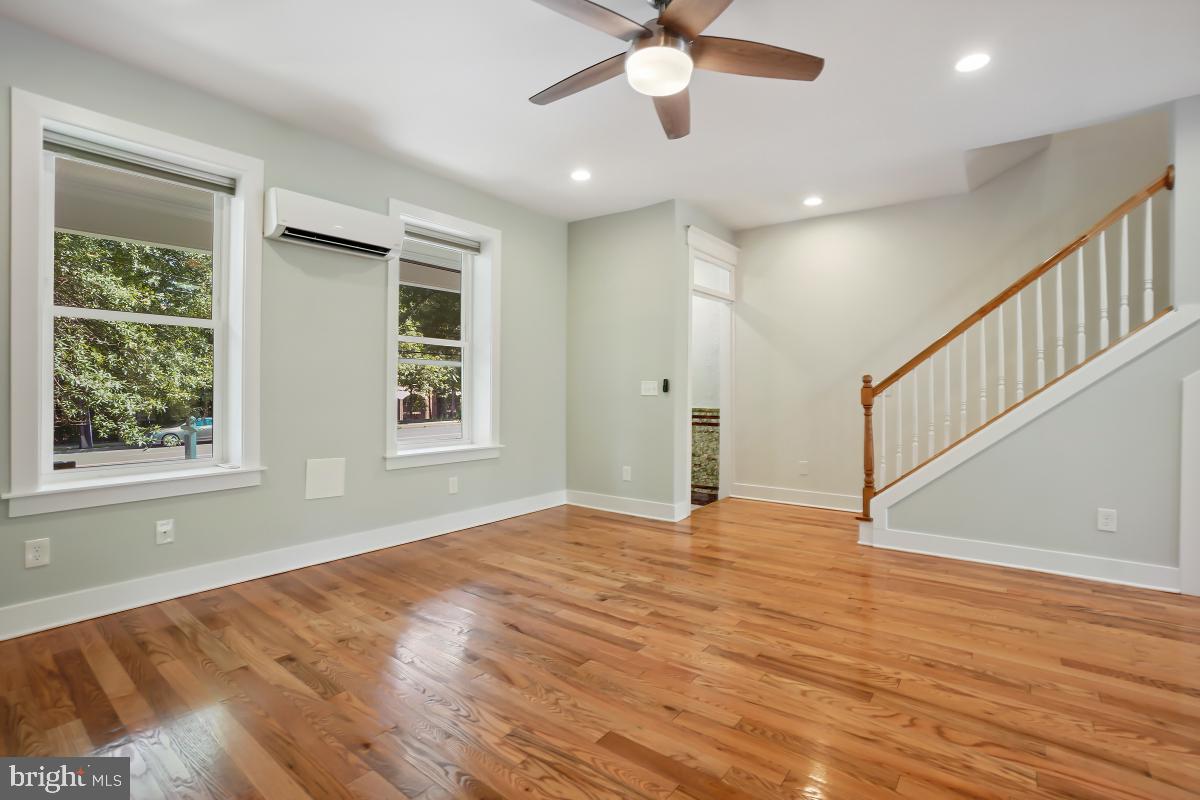37 Michigan Avenue Northeast Washington, DC 20002 - Photo 6 of 31 a view of an empty room with wooden floor and a window