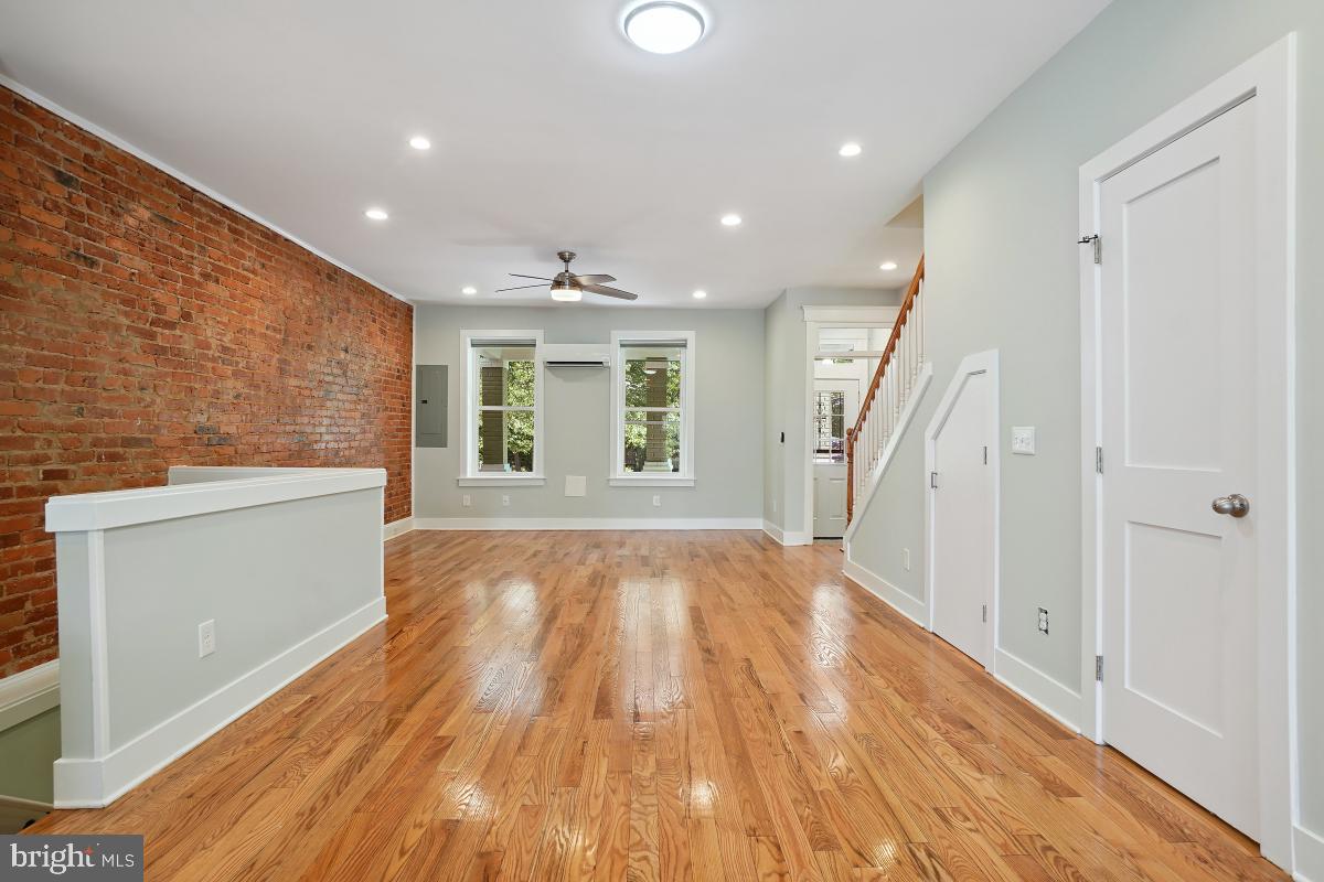 37 Michigan Avenue Northeast Washington, DC 20002 - Photo 8 of 31 wooden floor in an empty room with a window