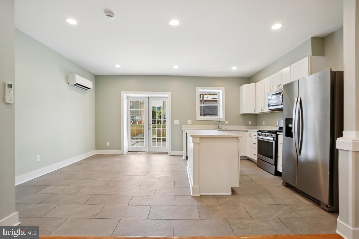 37 Michigan Avenue Northeast Washington, DC 20002 - Photo 10 of 31 a kitchen with a refrigerator and a stove top oven