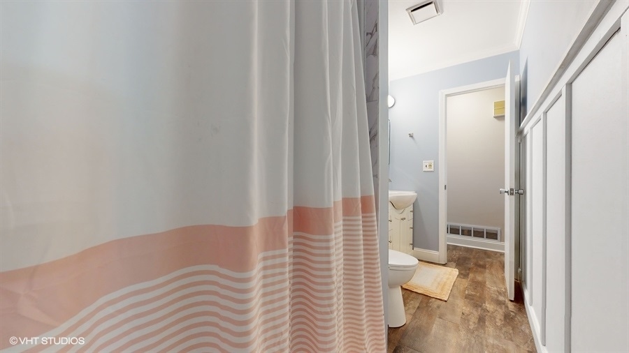 2321 Spring Hill Lane Lindenhurst, IL 60046 - Photo 20 of 30 a bedroom with a bed and a view of balcony