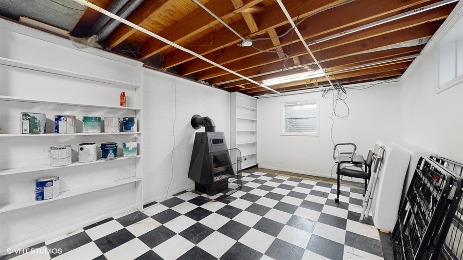 2321 Spring Hill Lane Lindenhurst, IL 60046 - Photo 24 of 30 a storage and utility room with a washing machine checkered tile floor