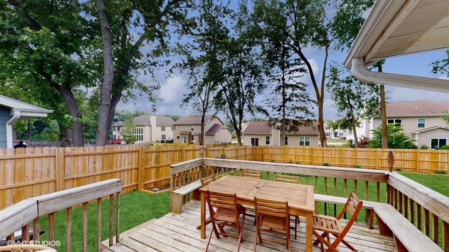 2321 Spring Hill Lane Lindenhurst, IL 60046 - Photo 25 of 30 a view of a balcony with wooden floor and fence