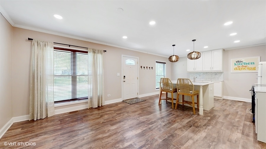 2321 Spring Hill Lane Lindenhurst, IL 60046 - Photo 6 of 30 a view of kitchen with furniture and wooden floor