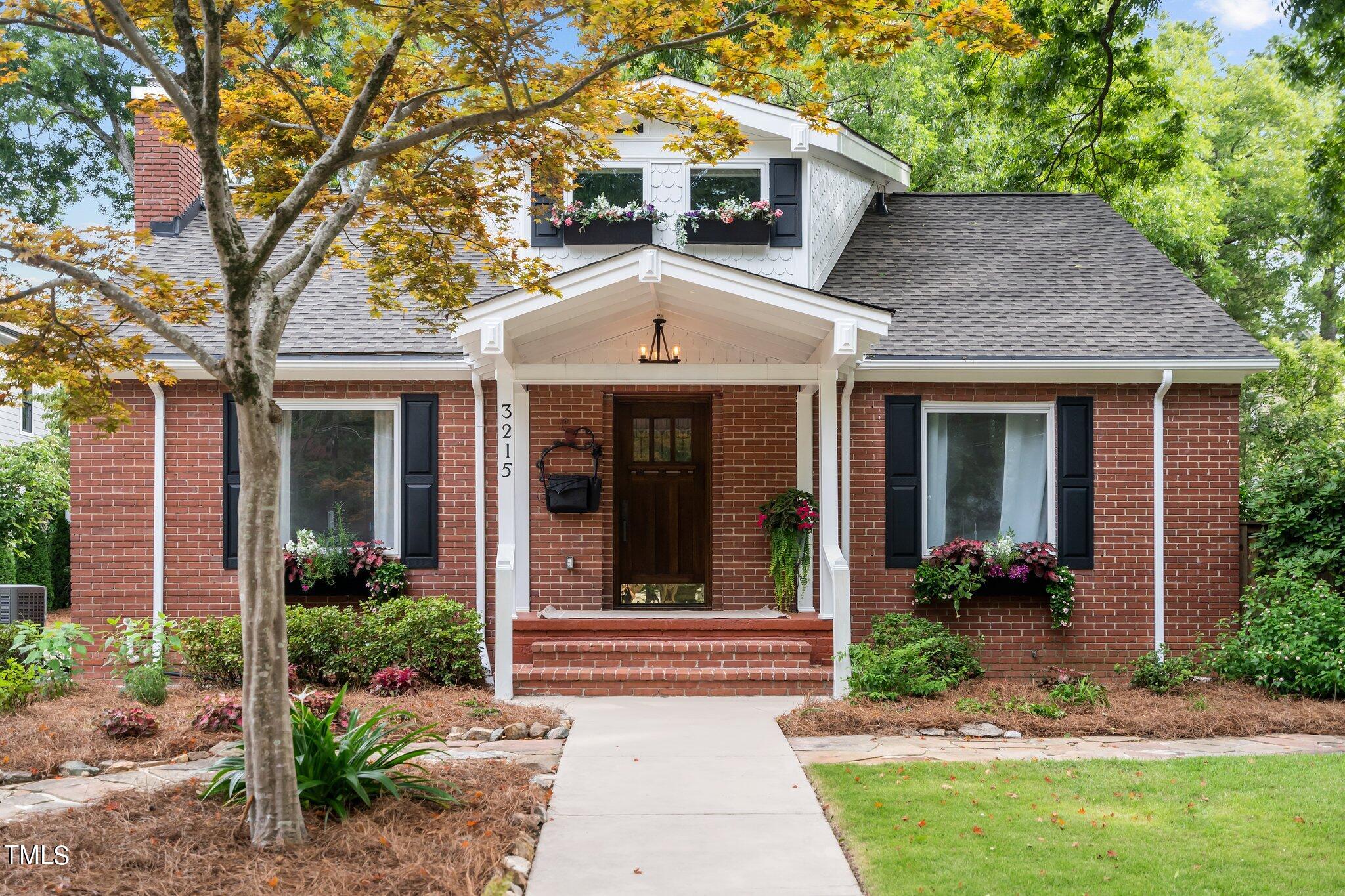 3215 Merriman Avenue Raleigh, NC 27607 - Photo 1 of 66 a front view of a house with garden