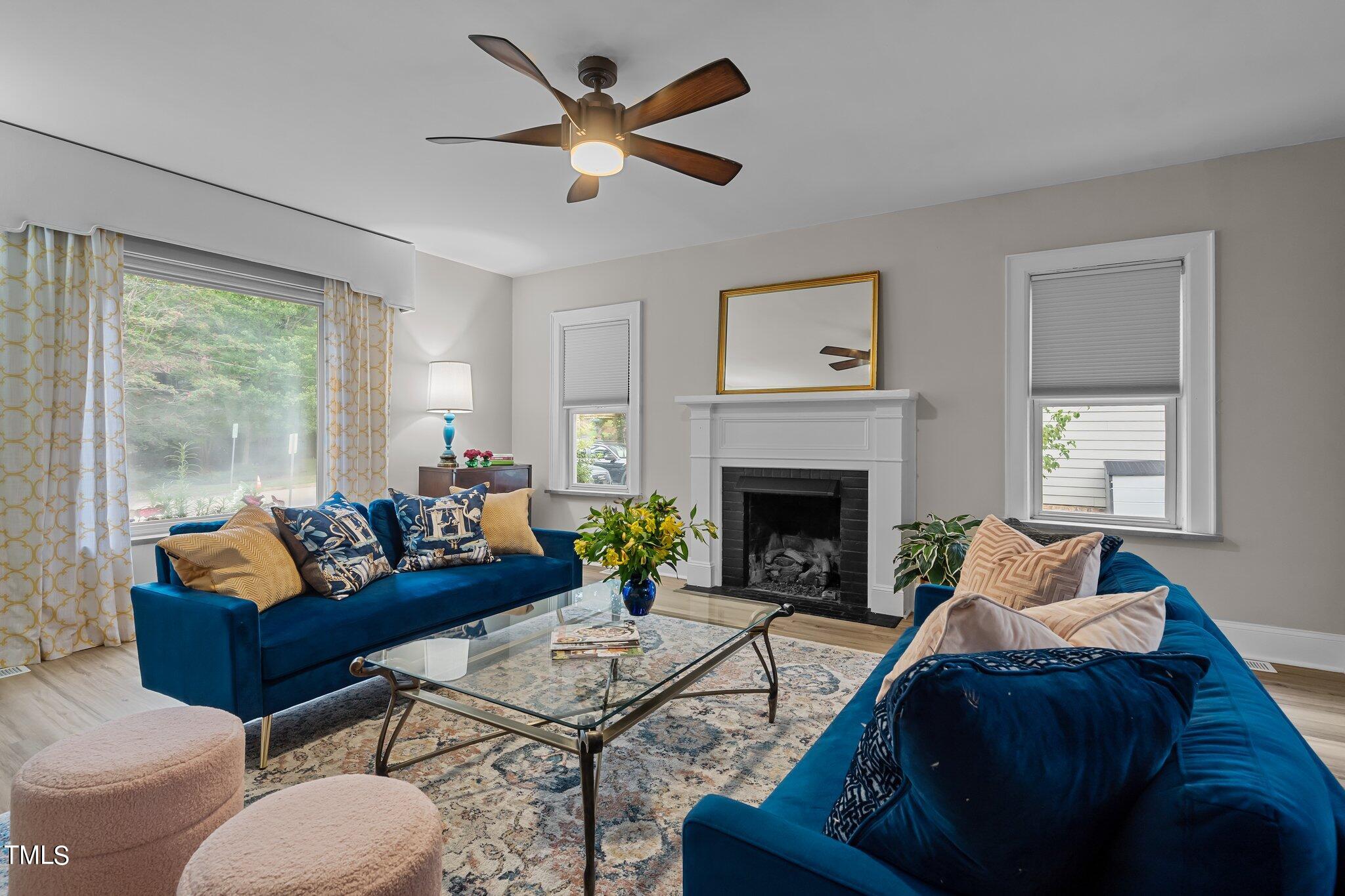 3215 Merriman Avenue Raleigh, NC 27607 - Photo 14 of 66 a living room with furniture and a fireplace