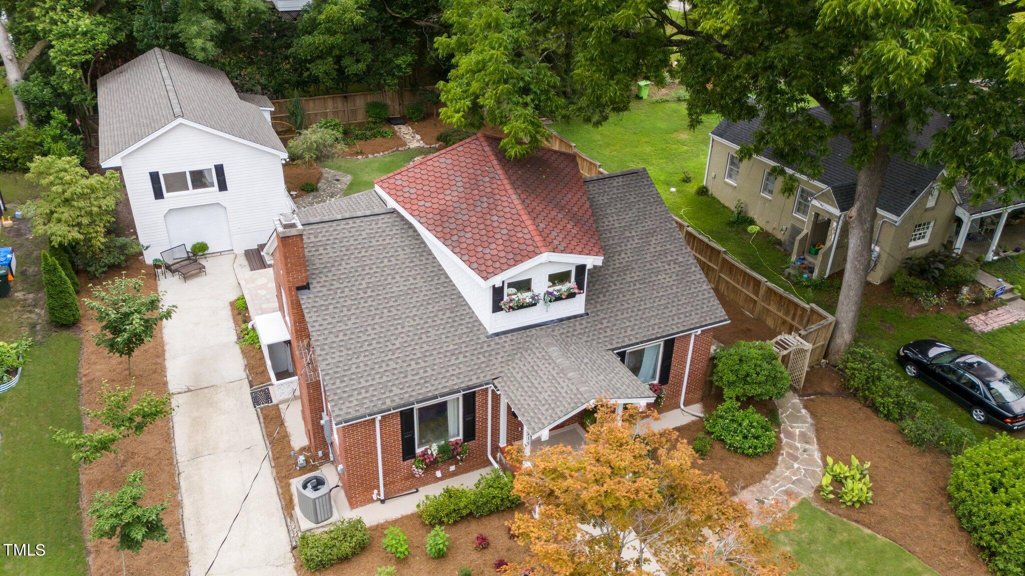 3215 Merriman Avenue Raleigh, NC 27607 - Photo 2 of 66 a view of a house with a yard plants and large tree