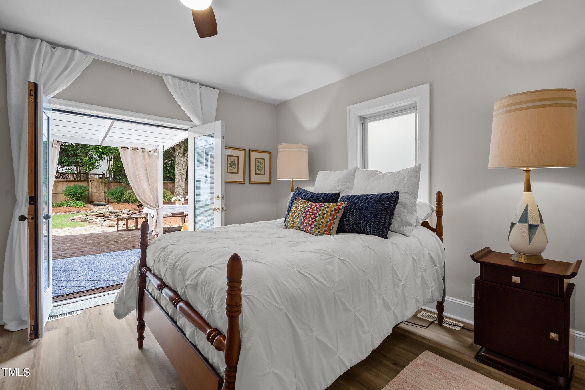 3215 Merriman Avenue Raleigh, NC 27607 - Photo 23 of 66 a bed room with a bed and a lamp
