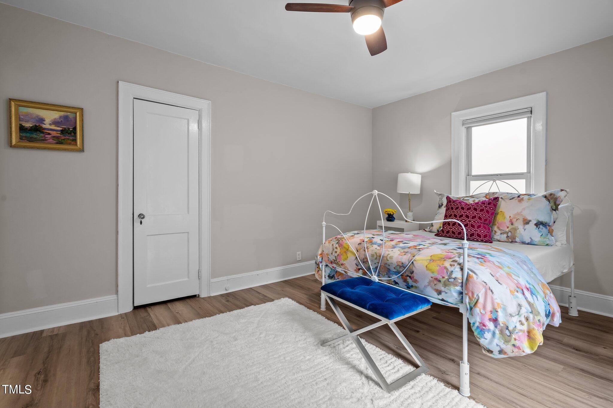 3215 Merriman Avenue Raleigh, NC 27607 - Photo 27 of 66 a bedroom with a bed and window
