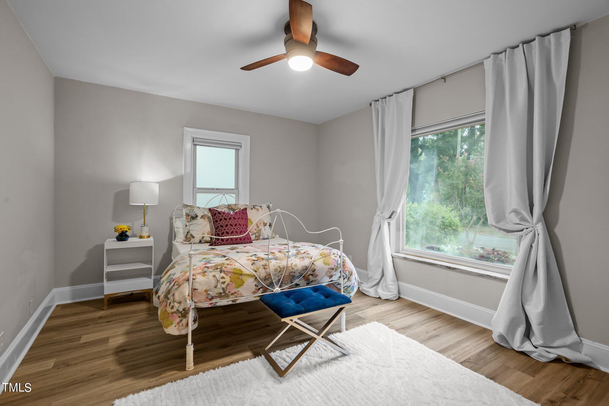 3215 Merriman Avenue Raleigh, NC 27607 - Photo 28 of 66 a bedroom with a bed and a window