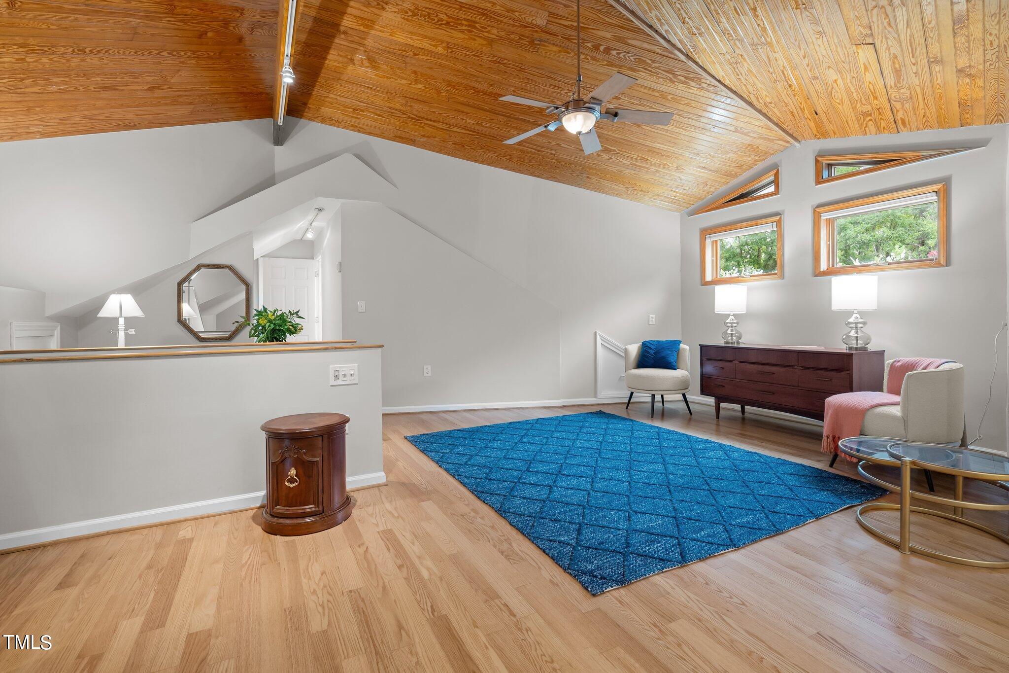 3215 Merriman Avenue Raleigh, NC 27607 - Photo 32 of 66 a living room with furniture and a wooden floor