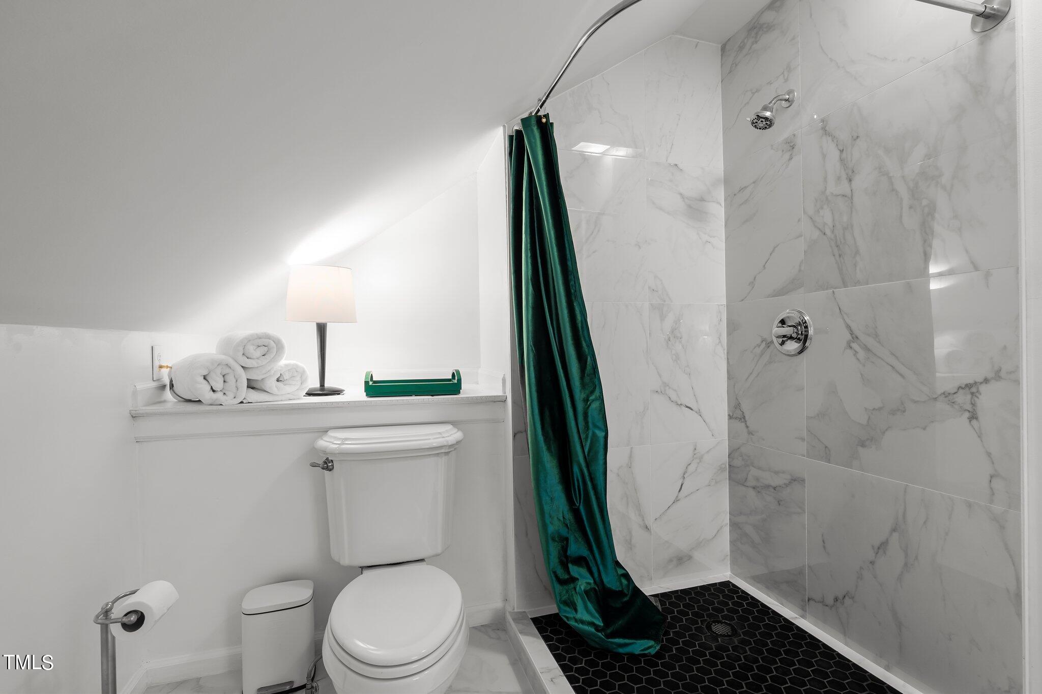 3215 Merriman Avenue Raleigh, NC 27607 - Photo 34 of 66 a bathroom with a toilet and a shower