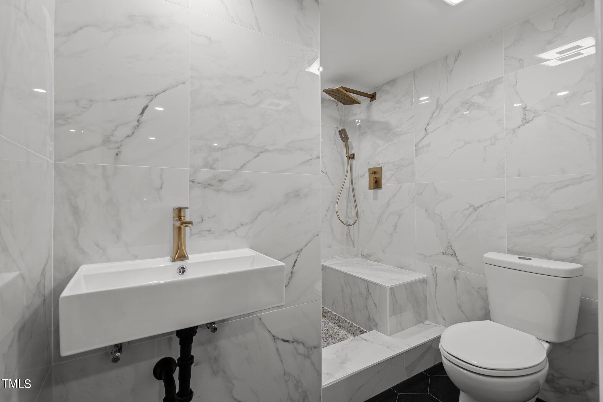 3215 Merriman Avenue Raleigh, NC 27607 - Photo 38 of 66 a bathroom with a sink toilet and shower