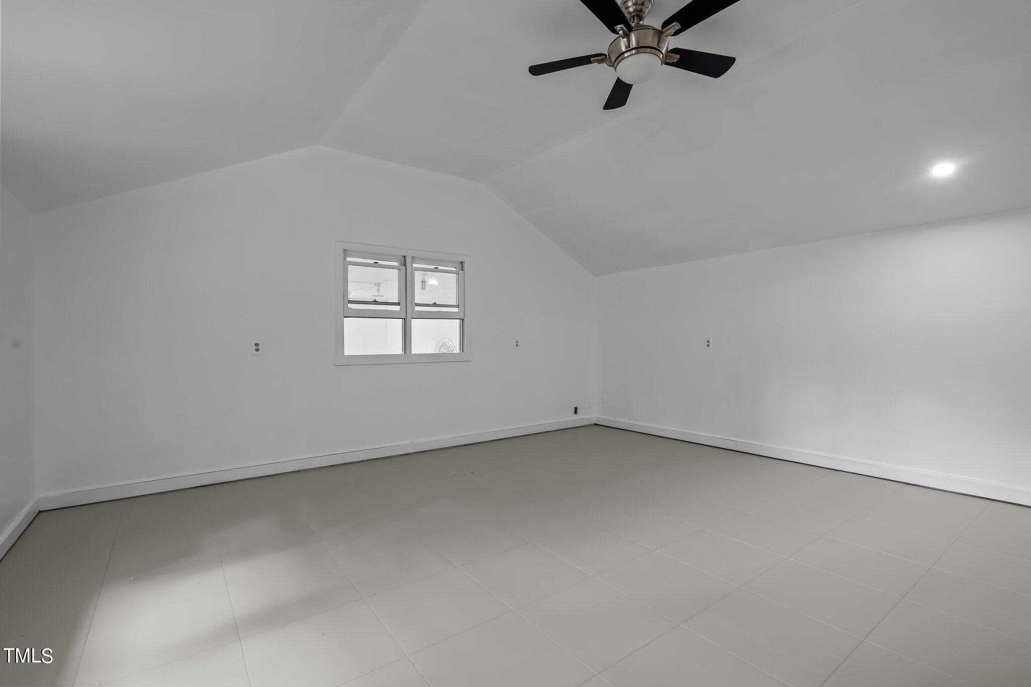 3215 Merriman Avenue Raleigh, NC 27607 - Photo 51 of 66 an empty room with a window and a fan
