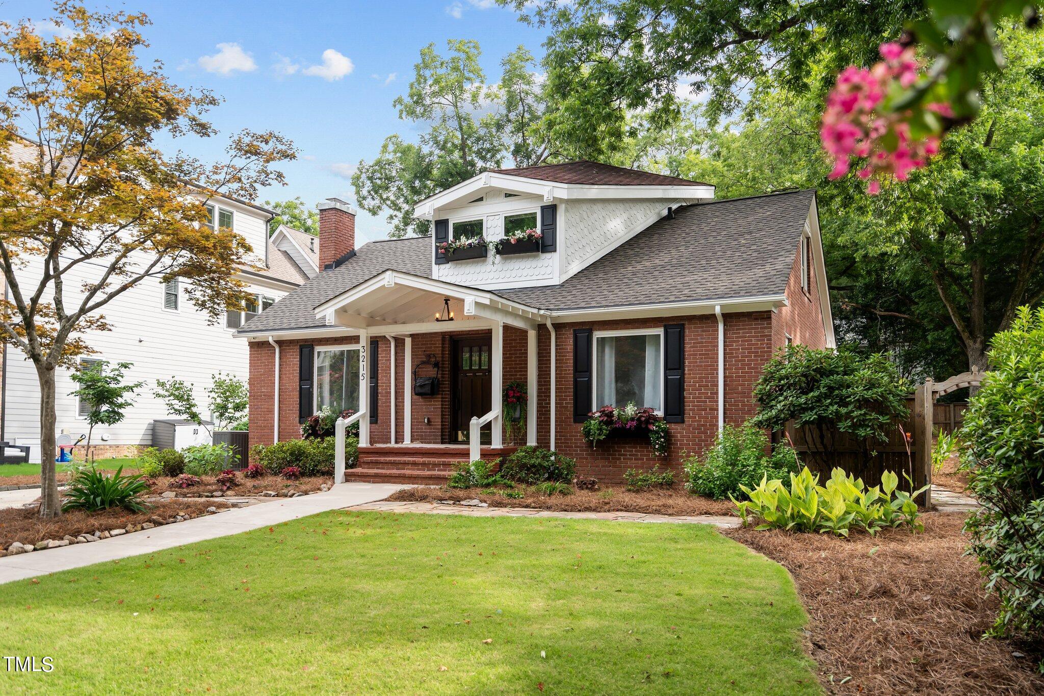 3215 Merriman Avenue Raleigh, NC 27607 - Photo 52 of 66 a front view of a house with a yard